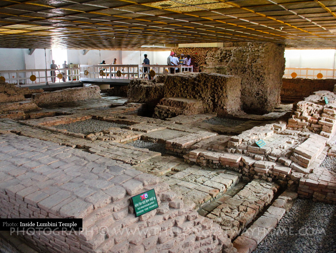 Bên trong đền thờ Hoàng hậu Ma Da là di tích nền gạch cũ cổ xưa. Inside the Mayadevi Temple